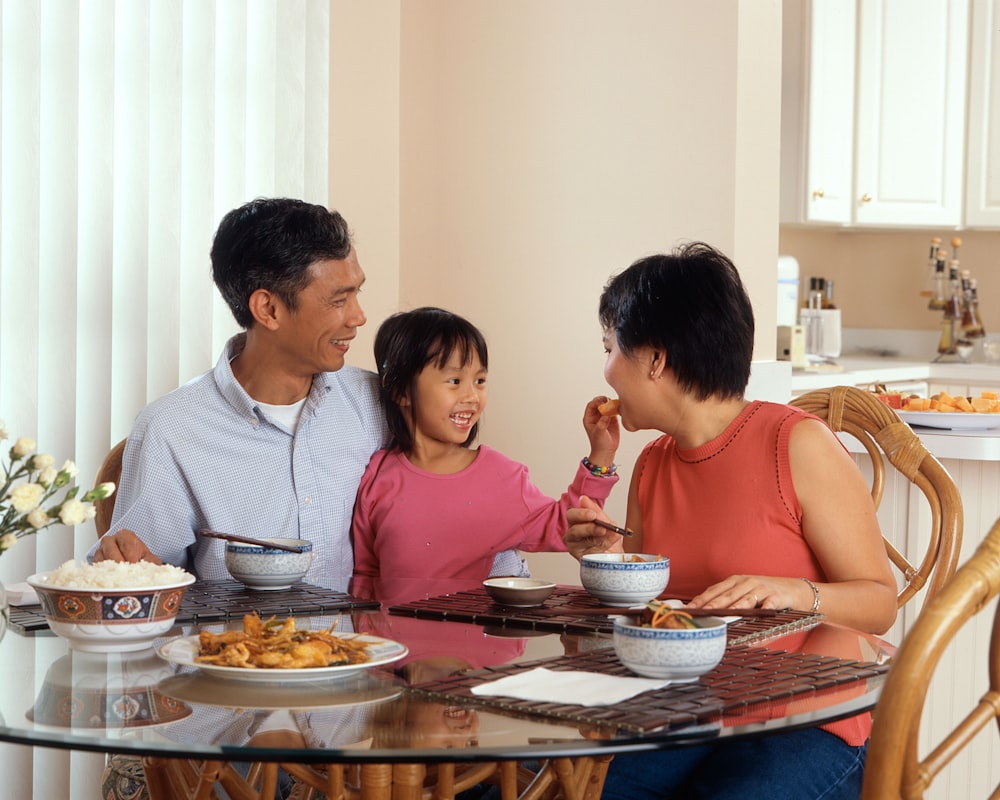 Parent and child reading nutrition labels together at the grocery store